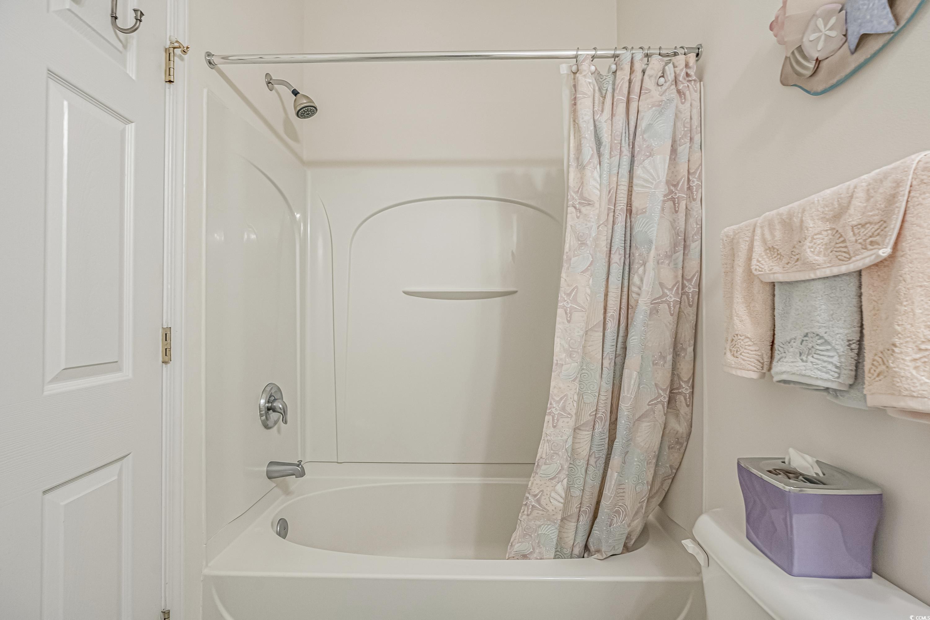 500 Wickham Drive, Unit HEATHERSTONE BUILDING 12 Myrtle Beach, SC 29579 - Photo 28 of 32 Bathroom featuring shower / bathtub combination with curtain and toilet