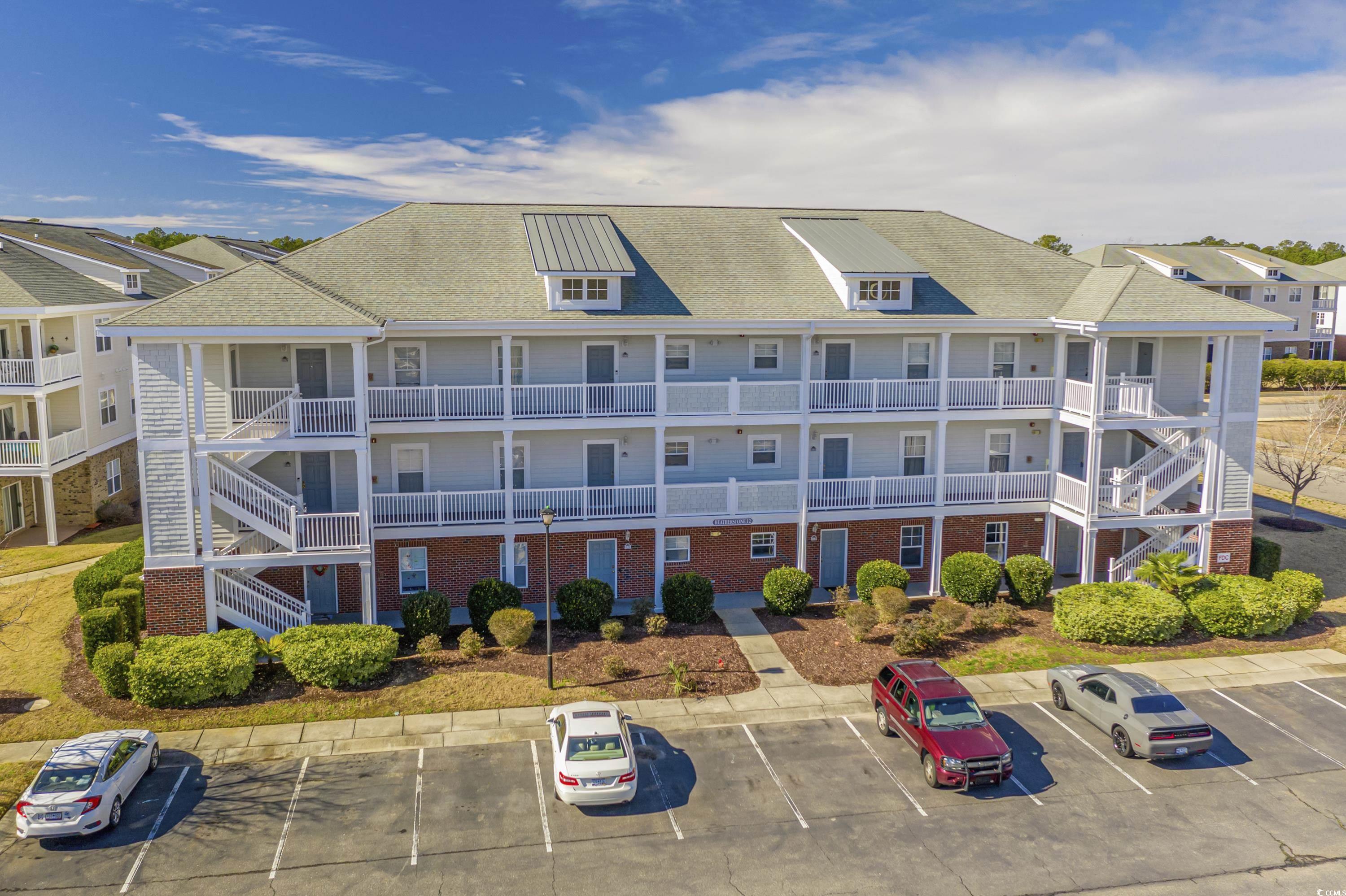 500 Wickham Drive, Unit HEATHERSTONE BUILDING 12 Myrtle Beach, SC 29579 - Photo 30 of 32 View of property with uncovered parking