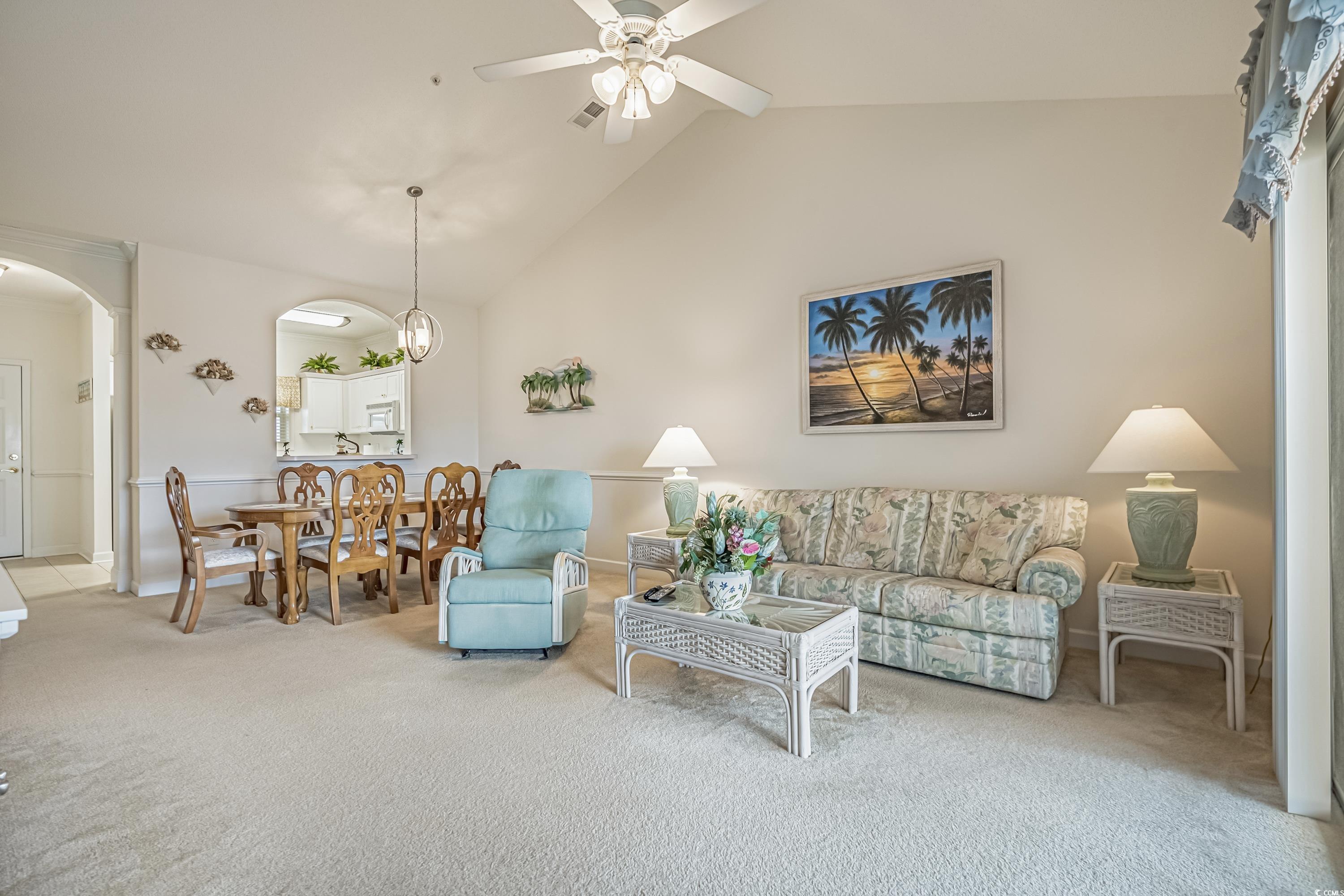 500 Wickham Drive, Unit HEATHERSTONE BUILDING 12 Myrtle Beach, SC 29579 - Photo 8 of 32 Living room with carpet flooring, arched walkways, ceiling fan, and high vaulted ceiling