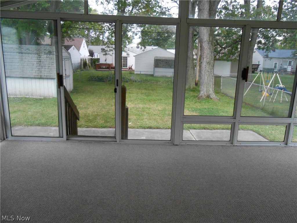 746 Quentin Road Eastlake, OH 44095 - Photo 12 of 15 Enclosed Patio opens to fenced yard!