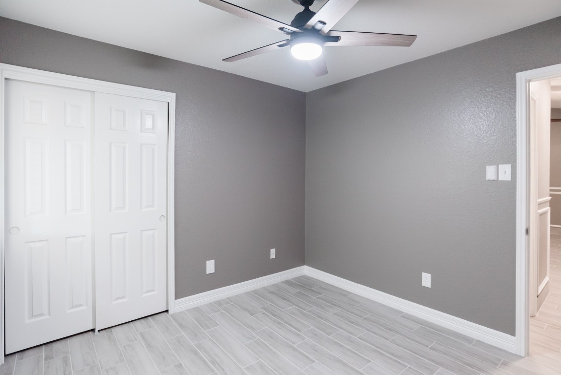 692 Scheel Kyle, TX 78640 - Photo 11 of 34 a view of an empty room with wooden floor