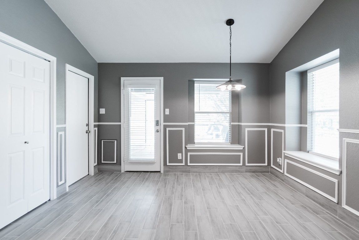 692 Scheel Kyle, TX 78640 - Photo 20 of 34 a view of empty room with wooden floor and window