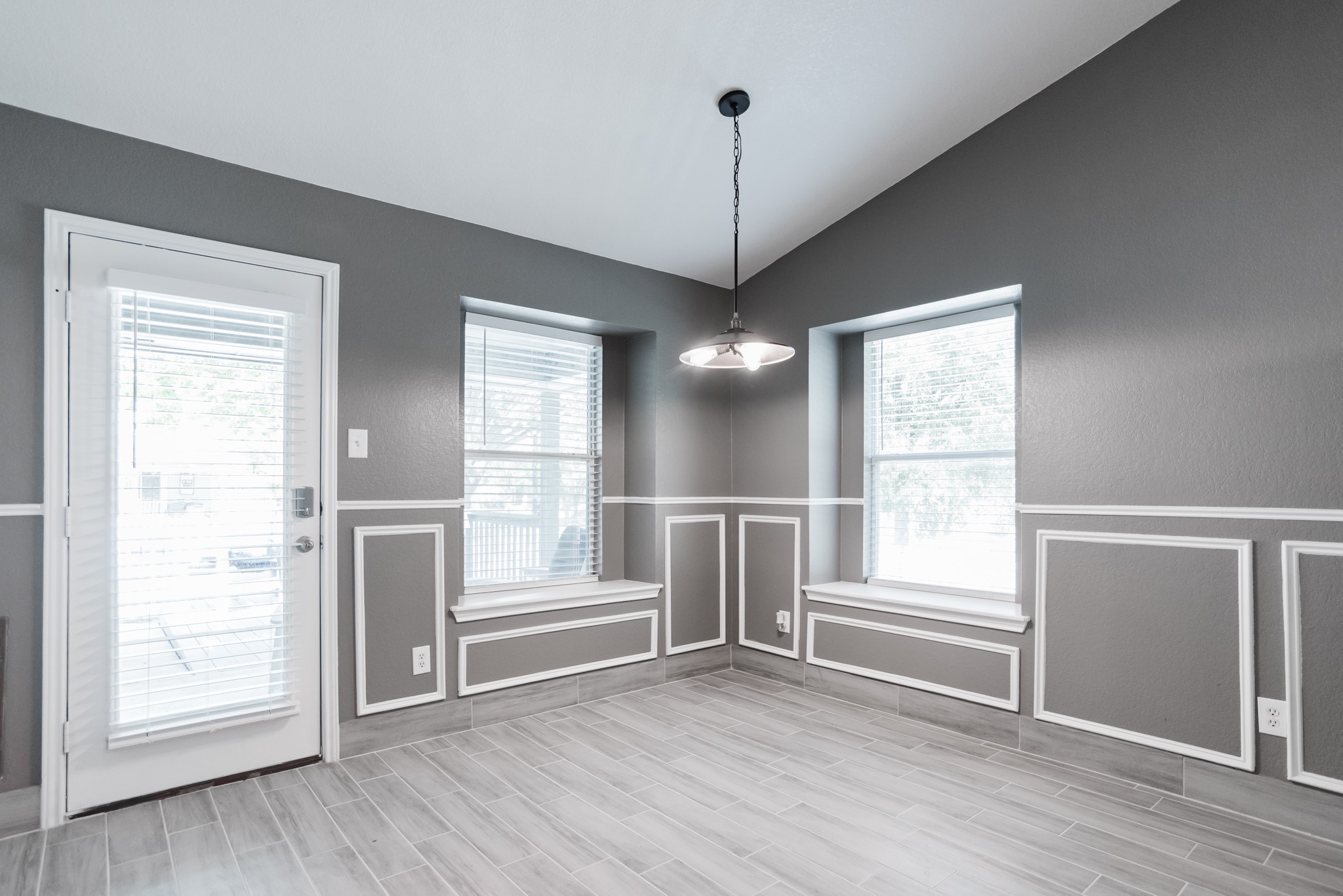 692 Scheel Kyle, TX 78640 - Photo 24 of 40 a view of an empty room with a window and wooden floor