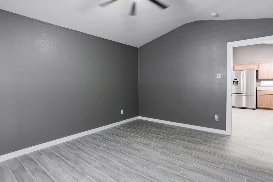 692 Scheel Kyle, TX 78640 - Photo 24 of 34 a view of empty room with wooden floor