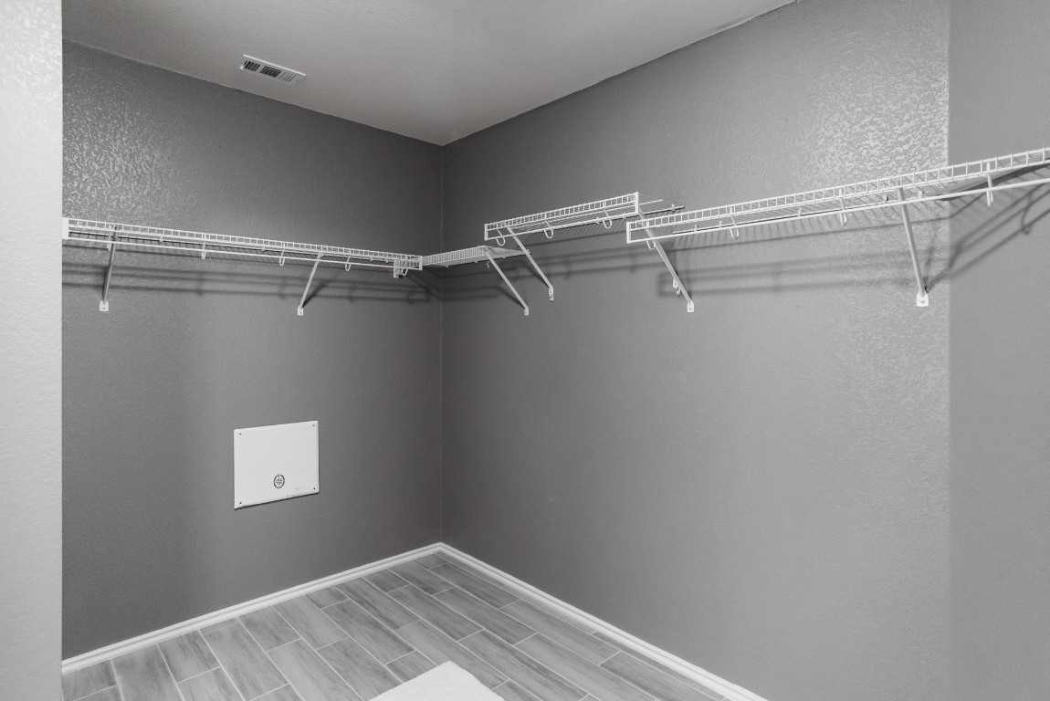 692 Scheel Kyle, TX 78640 - Photo 30 of 34 a view of a room with racks on the wall