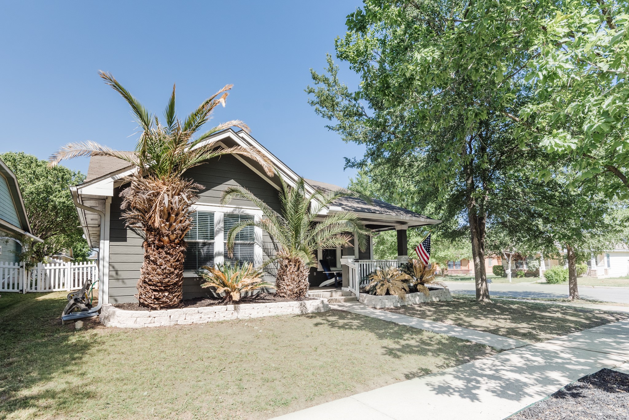 692 Scheel Kyle, TX 78640 - Photo 3 of 40 a front view of a house with garden