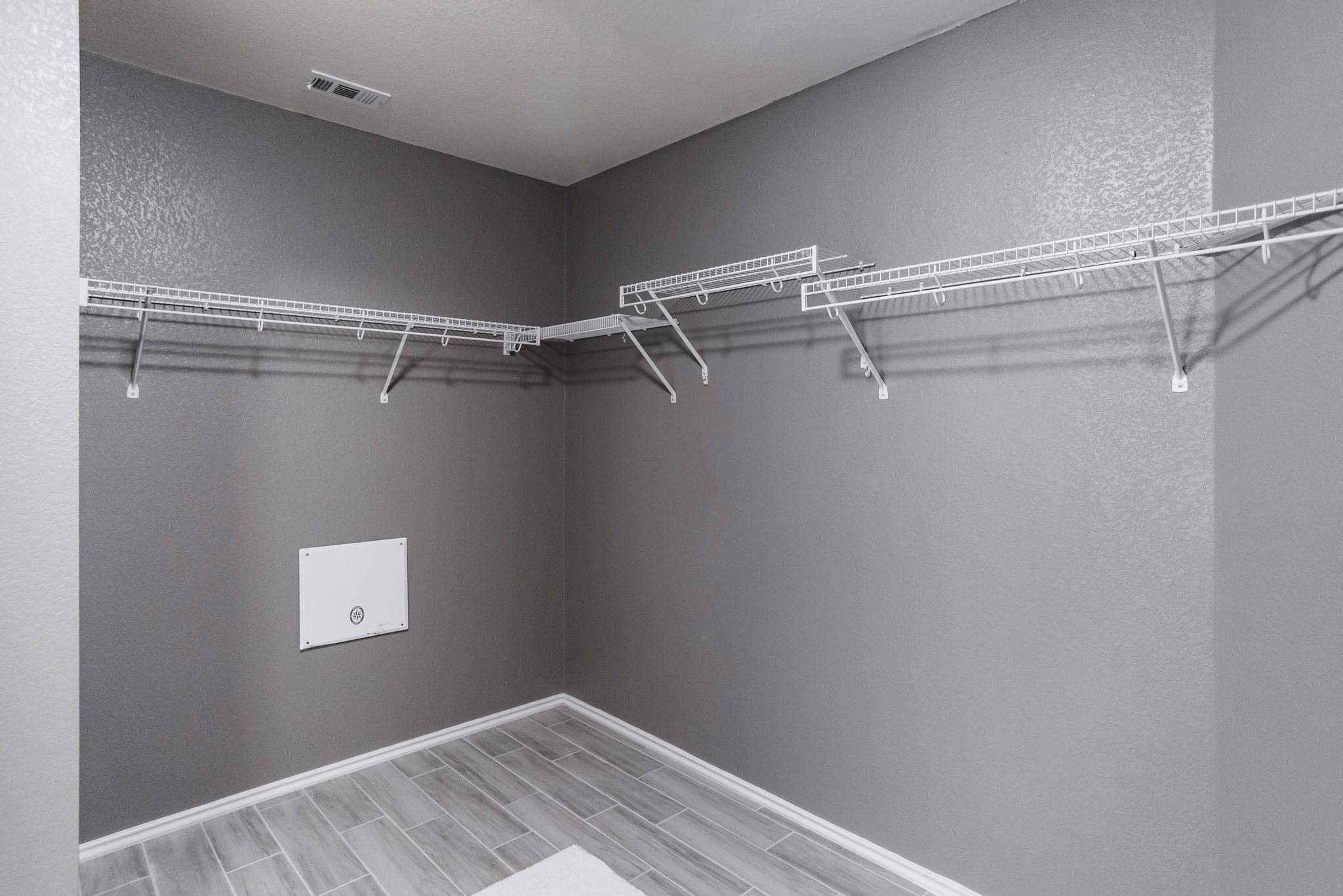 692 Scheel Kyle, TX 78640 - Photo 35 of 40 a view of a room with racks on the wall