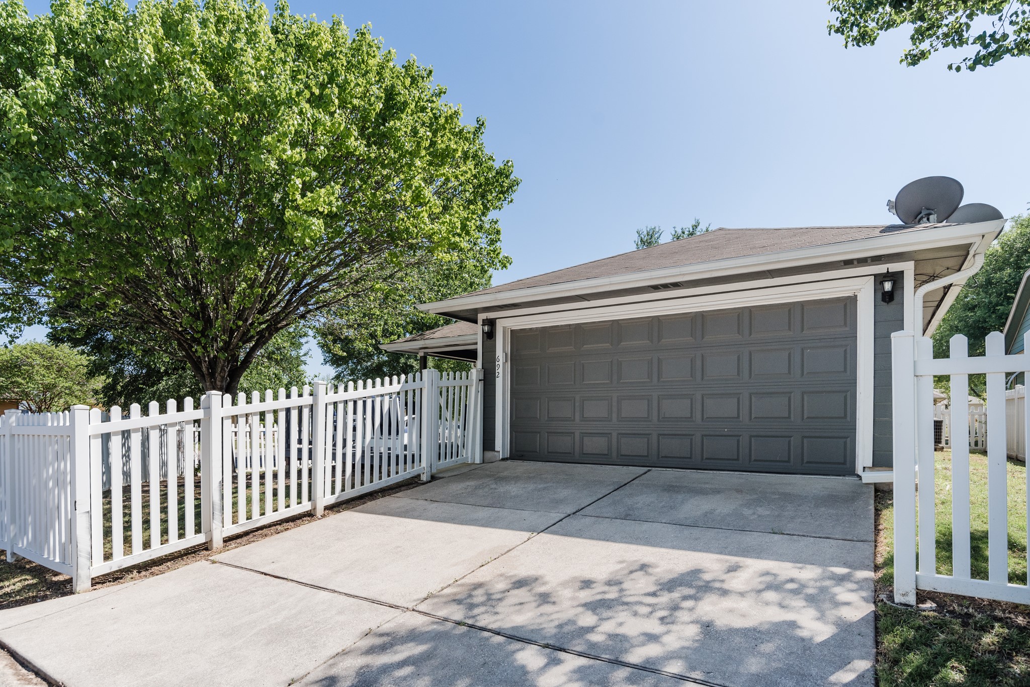692 Scheel Kyle, TX 78640 - Photo 39 of 40 a view of a house with a small yard and wooden fence