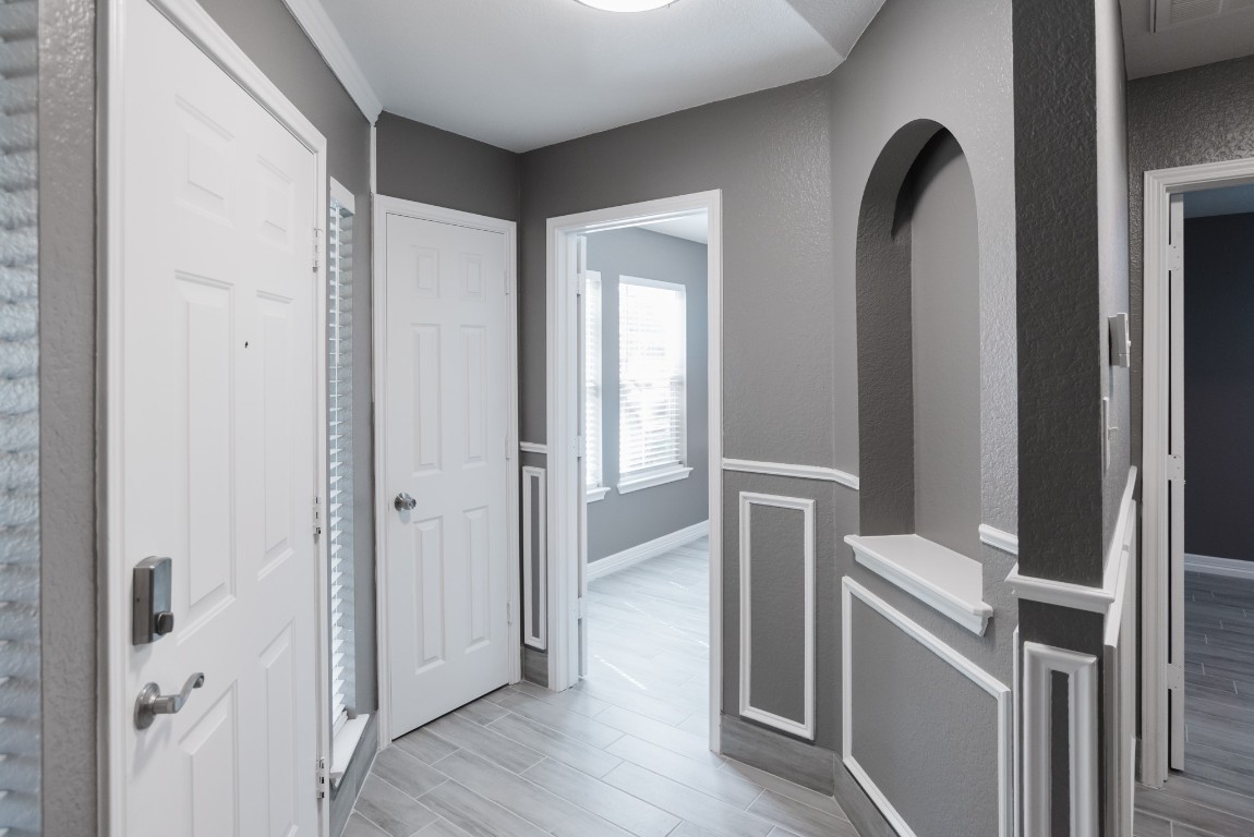 692 Scheel Kyle, TX 78640 - Photo 6 of 34 a view of hallway with wooden floor