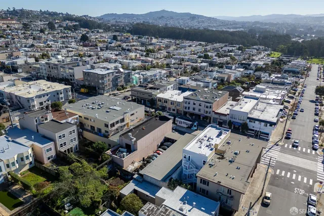 an aerial view of a city with lots of residential buildings