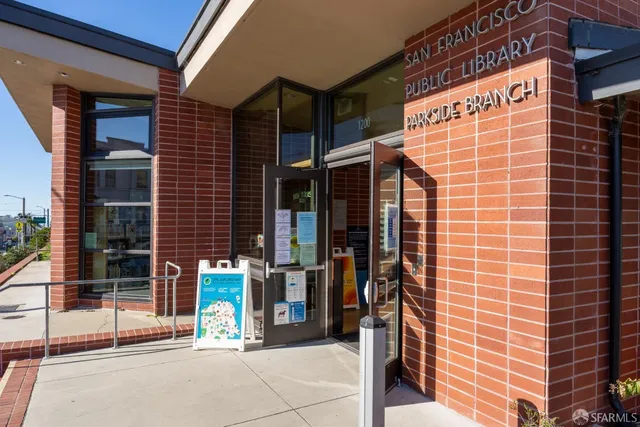 a view of entrance with a building and glass door