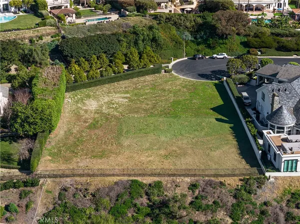 an aerial view of a house with a garden