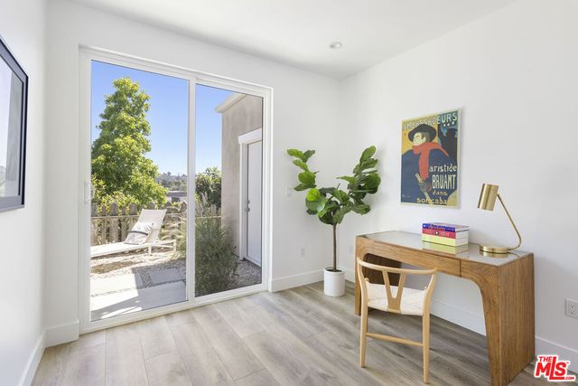 a bathroom with a sink a shower and a mirror