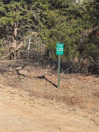 a sign that is on the side of a tree