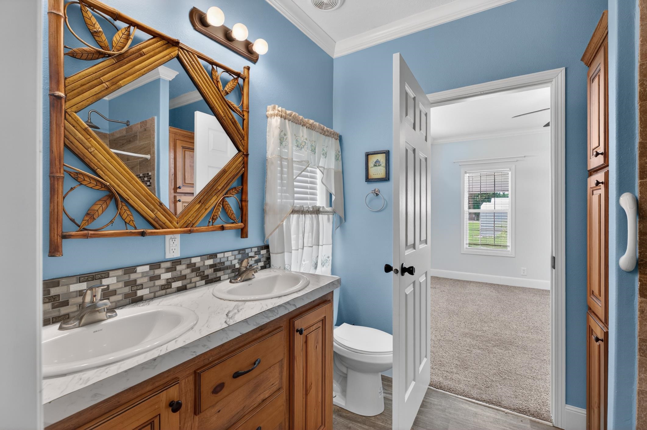 101 Trout Trail Crescent City, FL 32112 - Photo 15 of 45 a bathroom with a granite countertop sink a toilet and a mirror