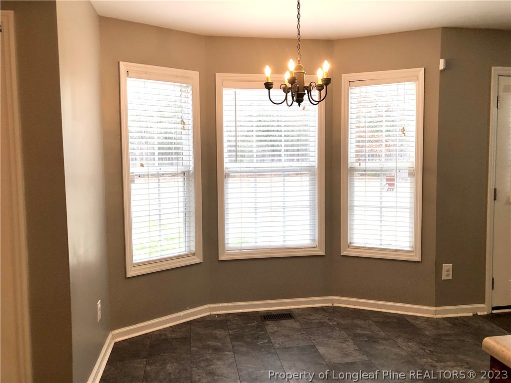 199 Falling Leaf Drive Raeford, NC 28376 - Photo 14 of 38 a view of an empty room with a window
