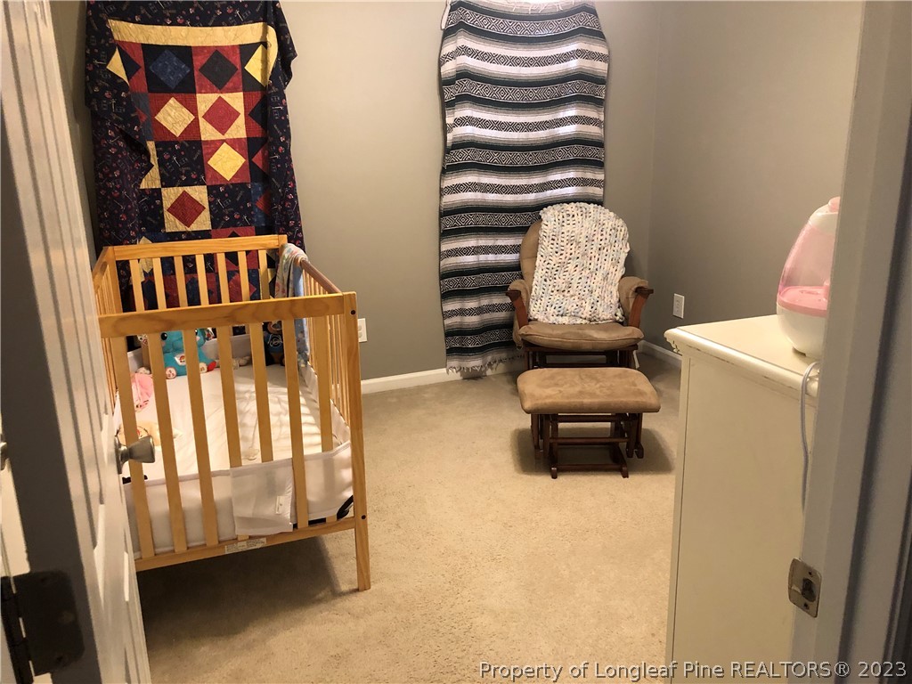 199 Falling Leaf Drive Raeford, NC 28376 - Photo 22 of 38 a bedroom with a bed and a window