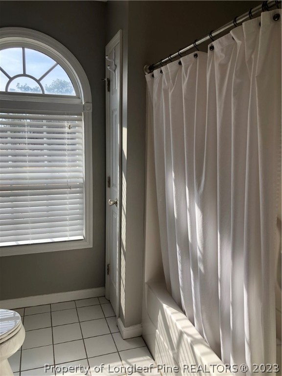 199 Falling Leaf Drive Raeford, NC 28376 - Photo 27 of 38 a view of a room that has a large window and chair