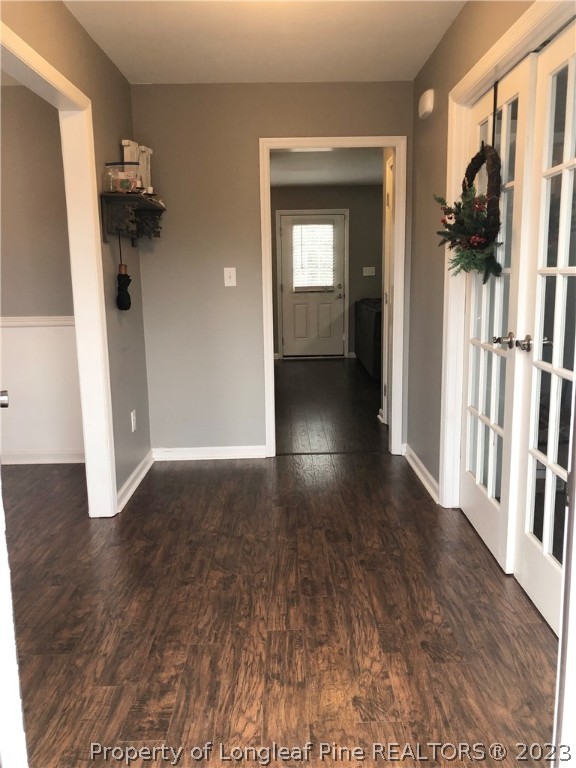 199 Falling Leaf Drive Raeford, NC 28376 - Photo 3 of 38 a view of a hallway with wooden floor and stairs