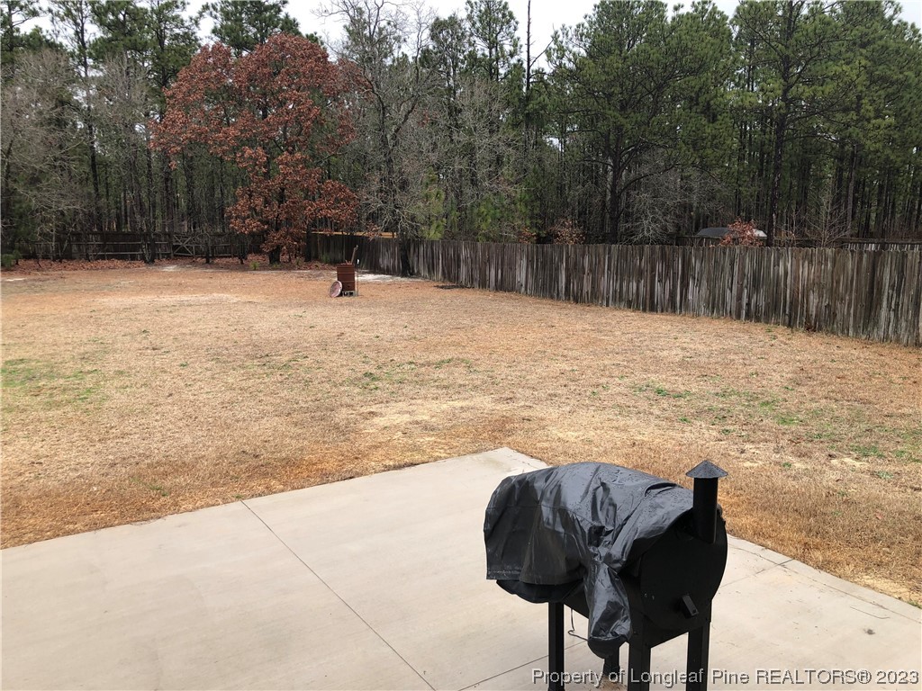 199 Falling Leaf Drive Raeford, NC 28376 - Photo 33 of 38 a swimming pool with wooden fence