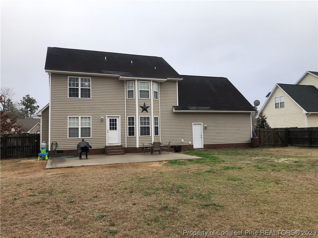 199 Falling Leaf Drive Raeford, NC 28376 - Photo 36 of 38 a view of a house with a yard