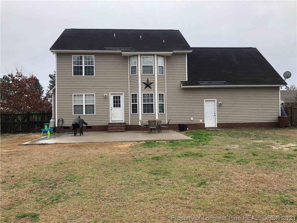 199 Falling Leaf Drive Raeford, NC 28376 - Photo 38 of 38 a front view of a house with a yard