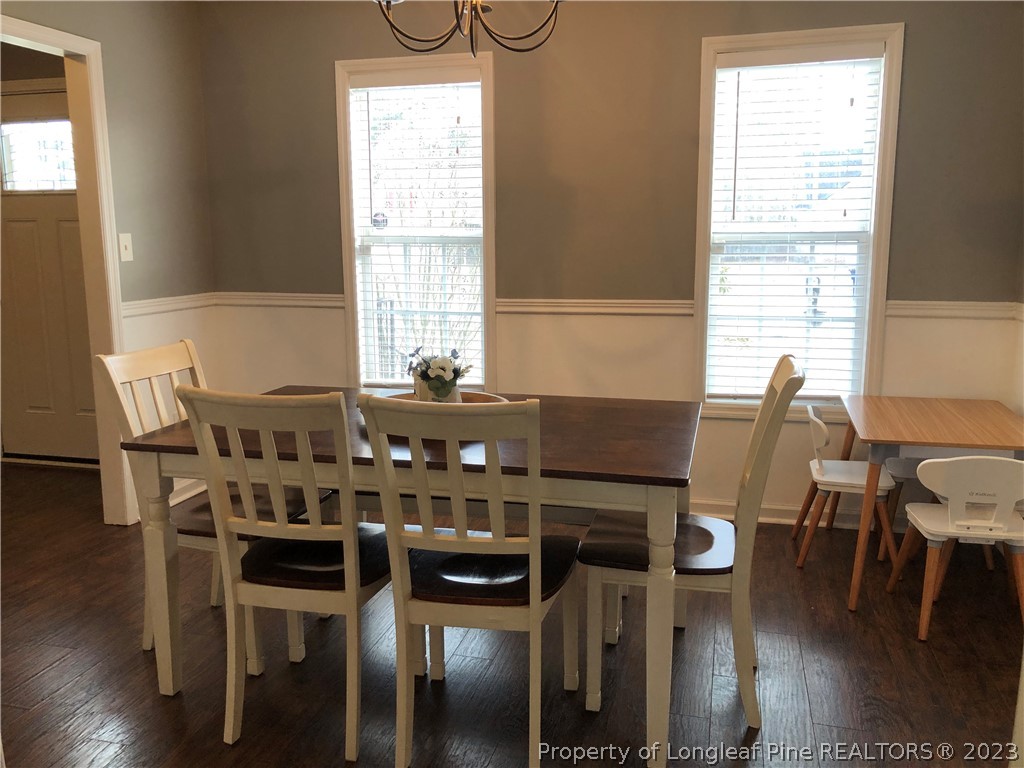 199 Falling Leaf Drive Raeford, NC 28376 - Photo 6 of 38 a view of a dining room with furniture window and wooden floor