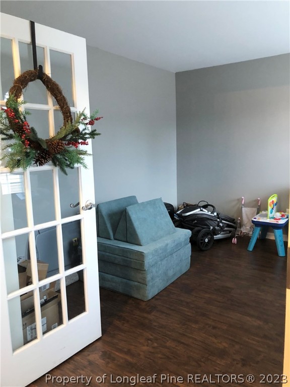 199 Falling Leaf Drive Raeford, NC 28376 - Photo 9 of 38 a living room with furniture and a wooden floor