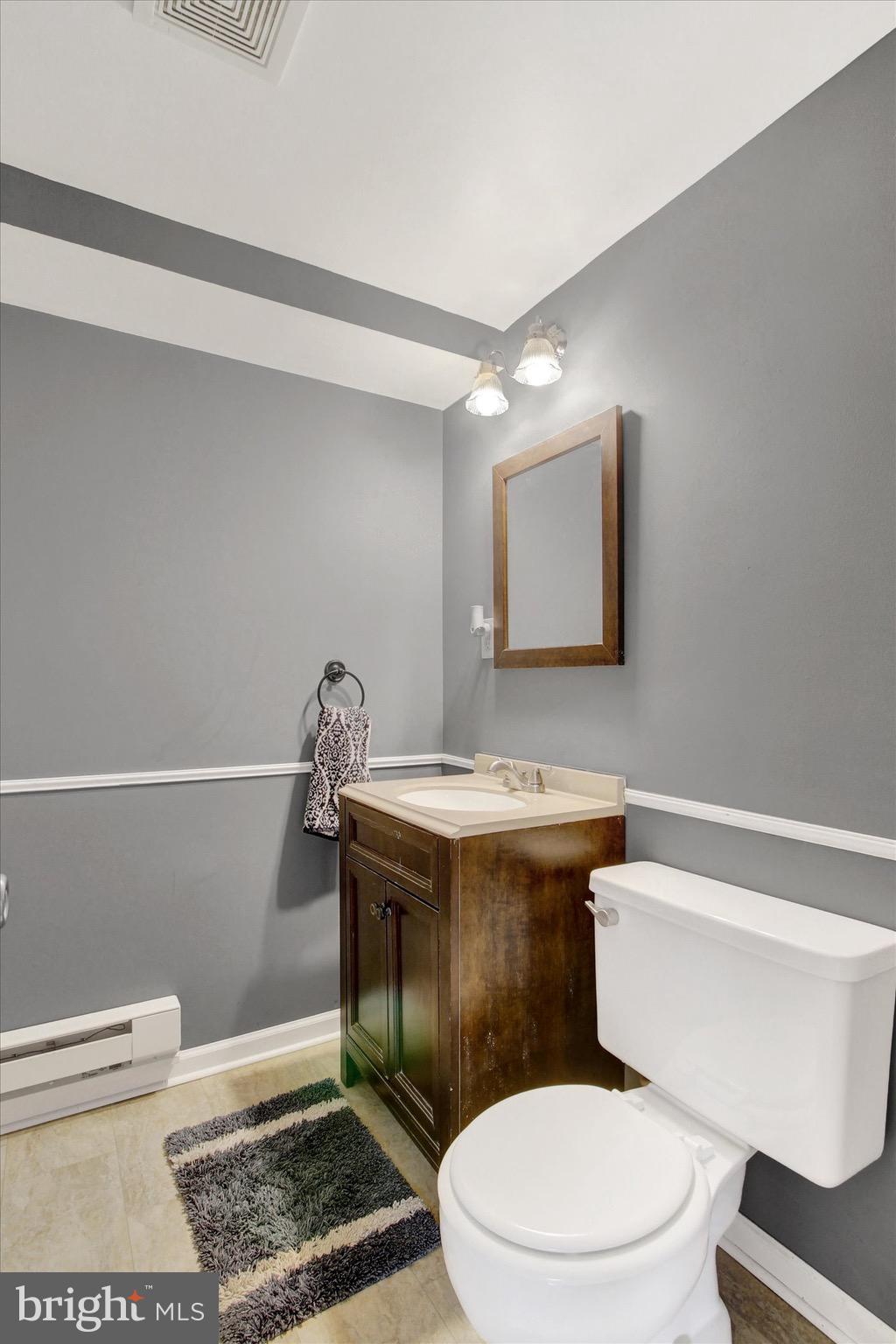 29 Meadowview Drive Hanover, PA 17331 - Photo 15 of 18 a white toilet sitting next to a bathroom sink
