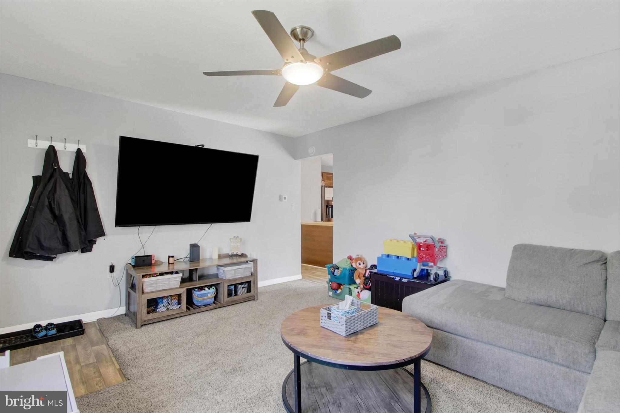 29 Meadowview Drive Hanover, PA 17331 - Photo 3 of 18 a living room with furniture and a flat screen tv