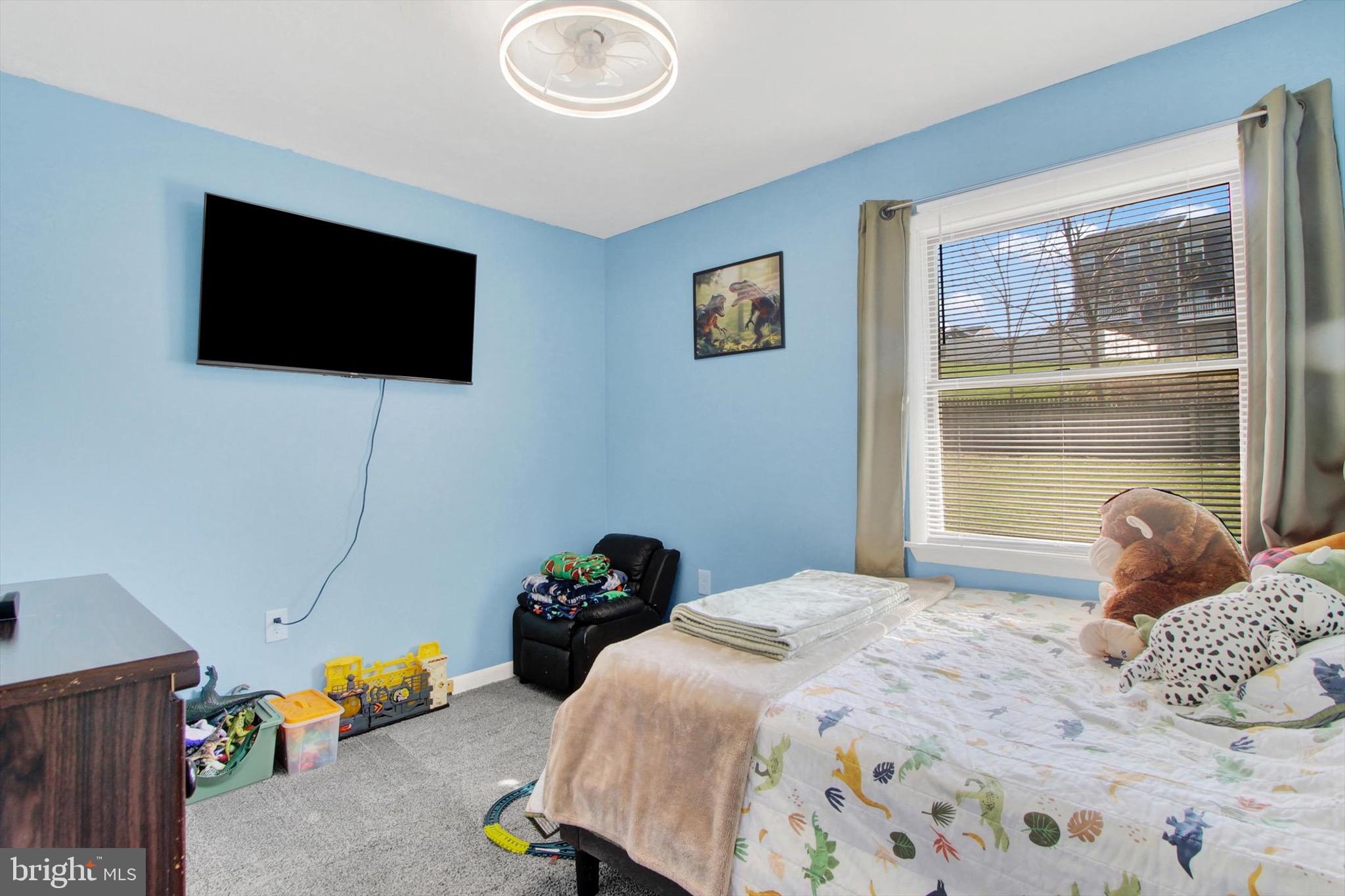 29 Meadowview Drive Hanover, PA 17331 - Photo 9 of 18 a bedroom with a bed a television and a window