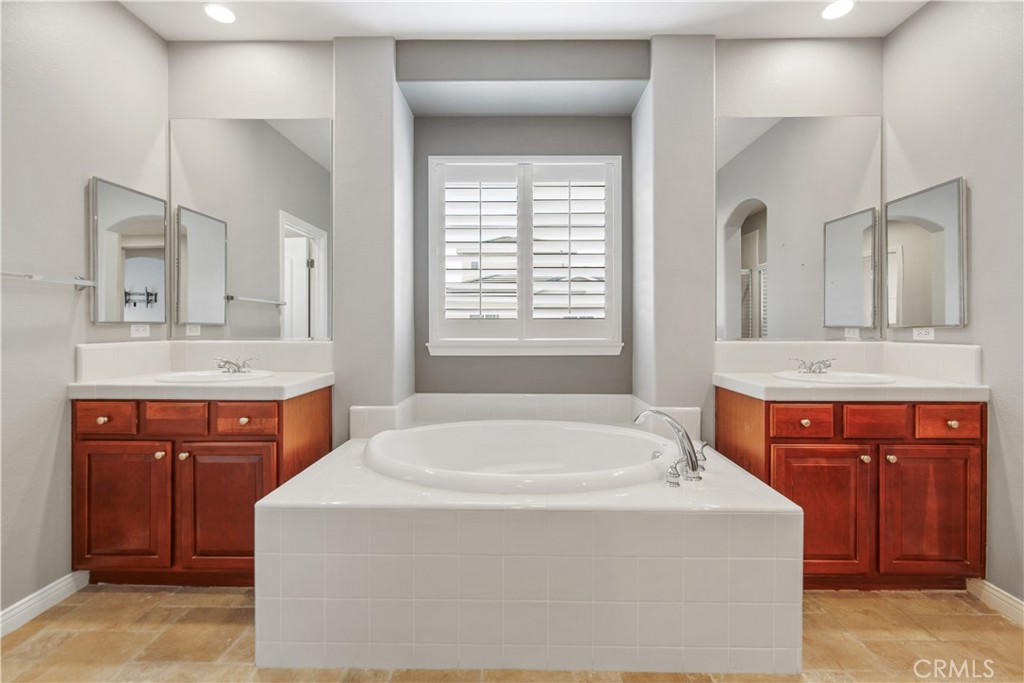 1 Bower Lane Ladera Ranch, CA 92694 - Photo 25 of 40 a bath tub sitting next to a bathroom sink