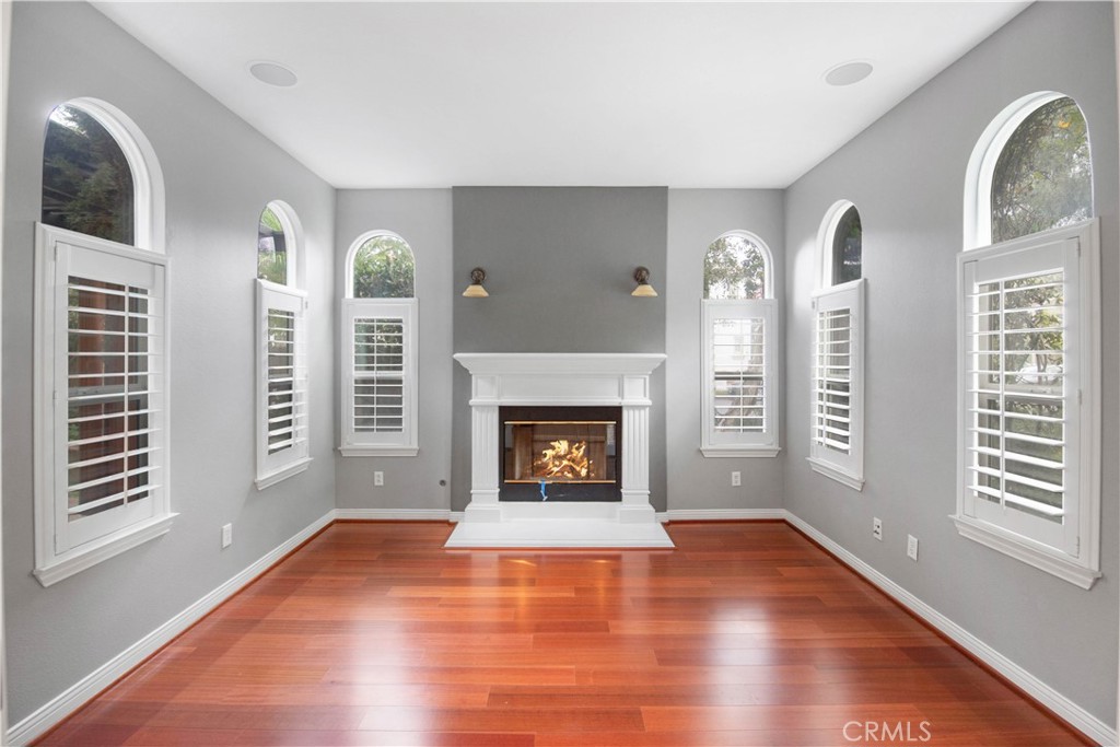 1 Bower Lane Ladera Ranch, CA 92694 - Photo 3 of 40 a view of an empty room with exposed radiator and fireplace