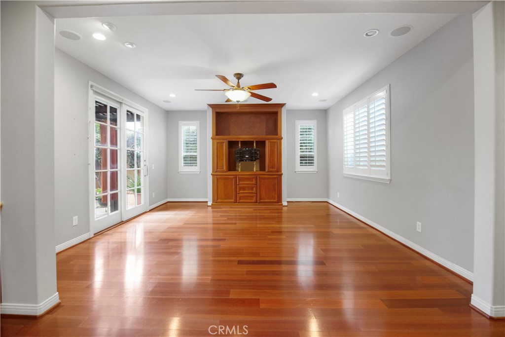 1 Bower Lane Ladera Ranch, CA 92694 - Photo 9 of 40 a view of an empty room with wooden floor and a window