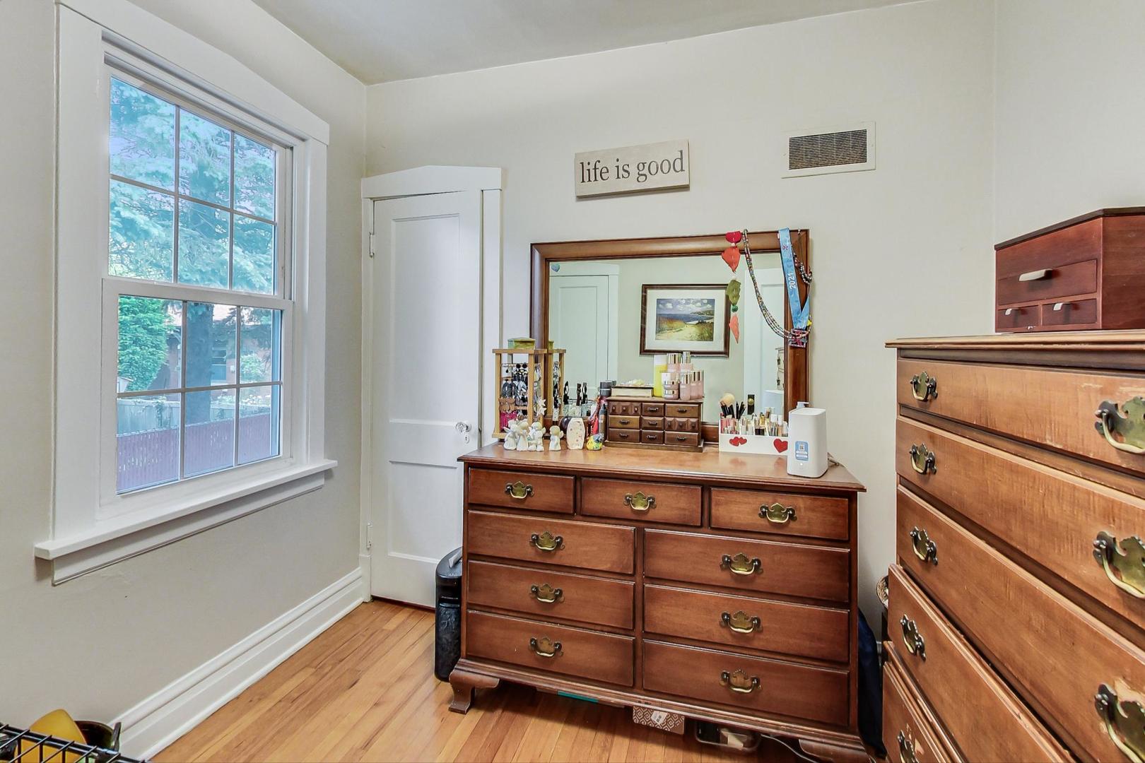 132 East Burlington Street Riverside, IL 60546 - Photo 17 of 38 a room with a dresser and a mirror