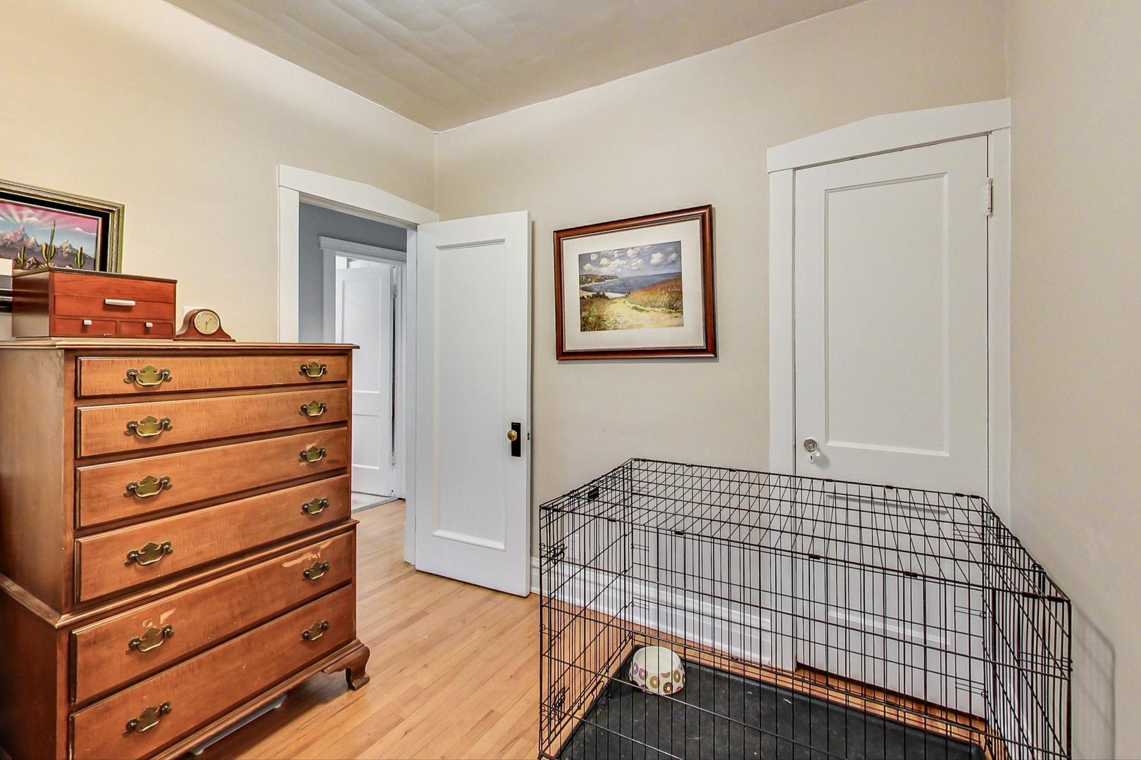 132 East Burlington Street Riverside, IL 60546 - Photo 18 of 38 a view of a bedroom with wooden floor