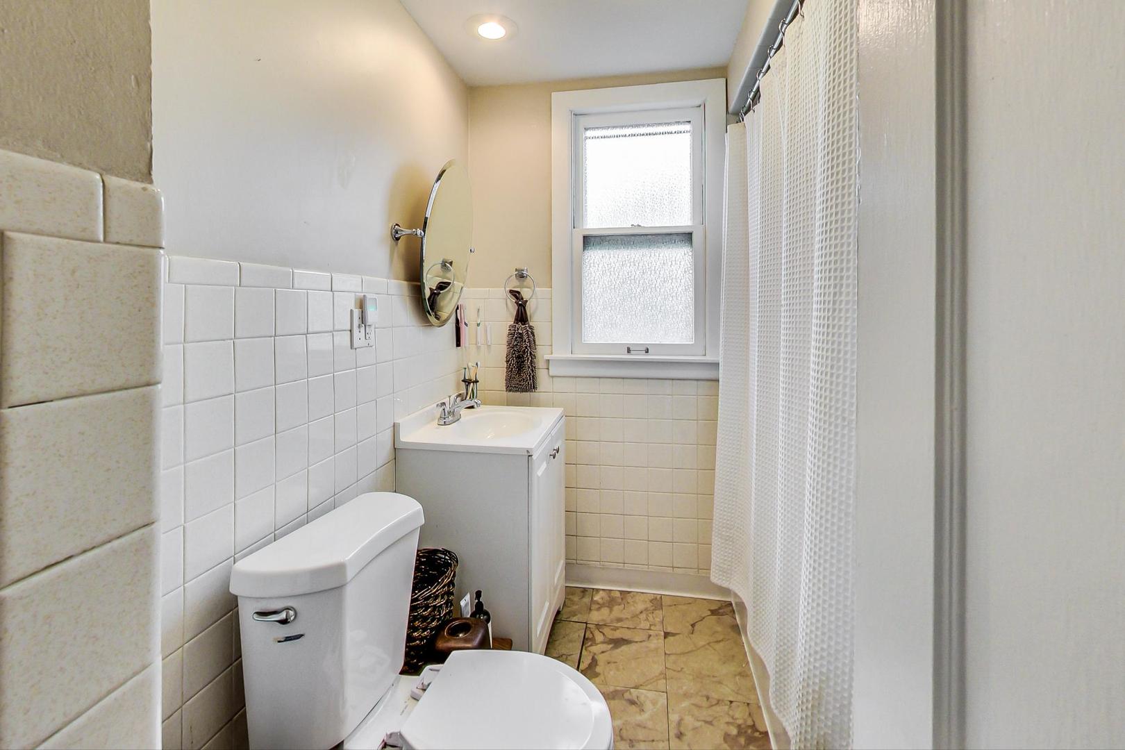 132 East Burlington Street Riverside, IL 60546 - Photo 20 of 38 a bathroom with a toilet and a sink