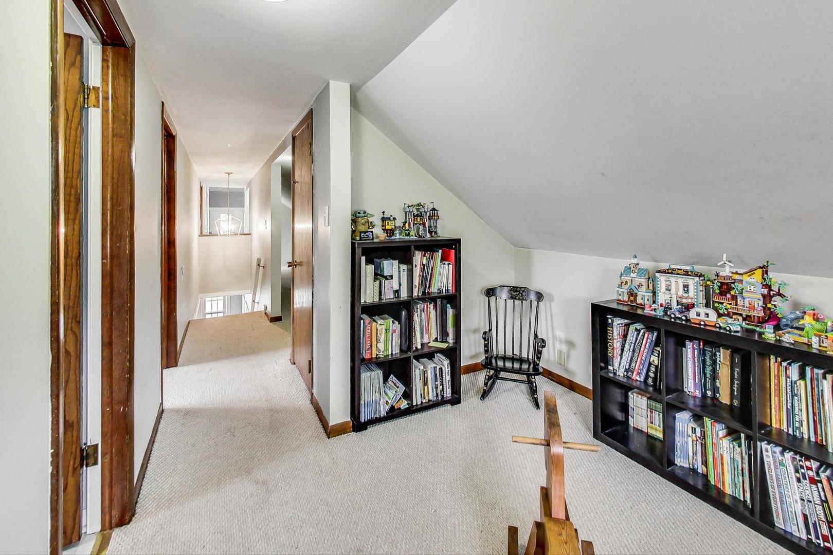 132 East Burlington Street Riverside, IL 60546 - Photo 22 of 38 a view of a livingroom with furniture and toys