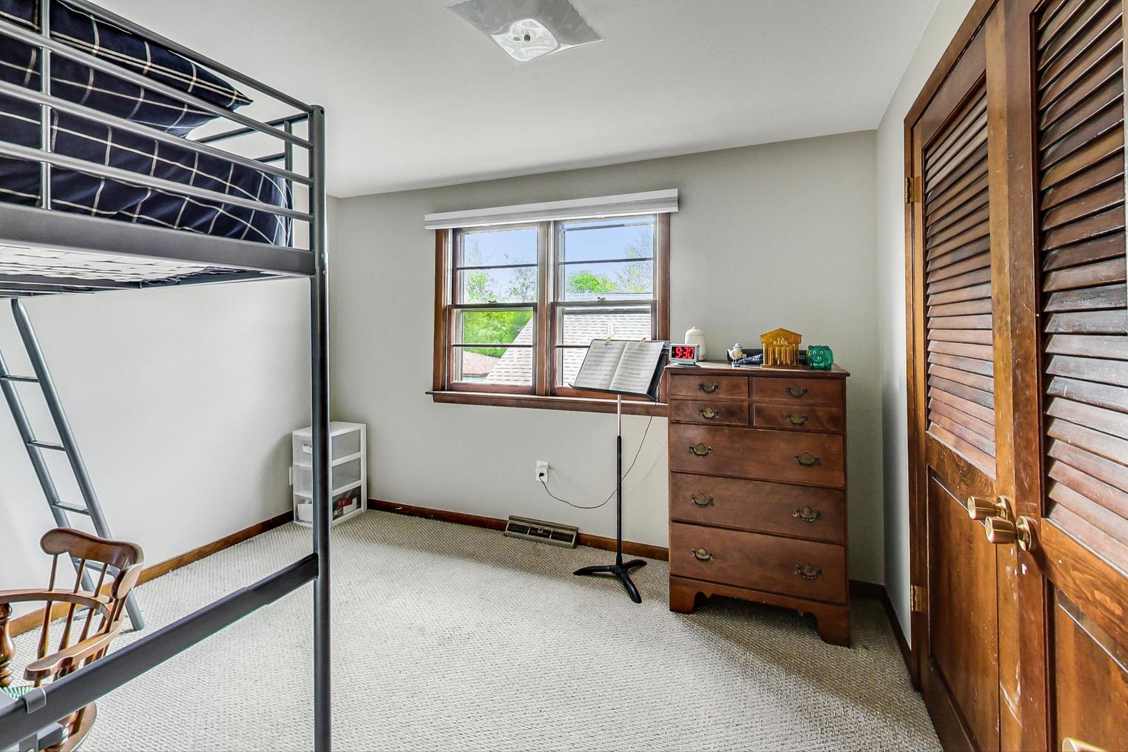 132 East Burlington Street Riverside, IL 60546 - Photo 23 of 38 a room with window and a dresser