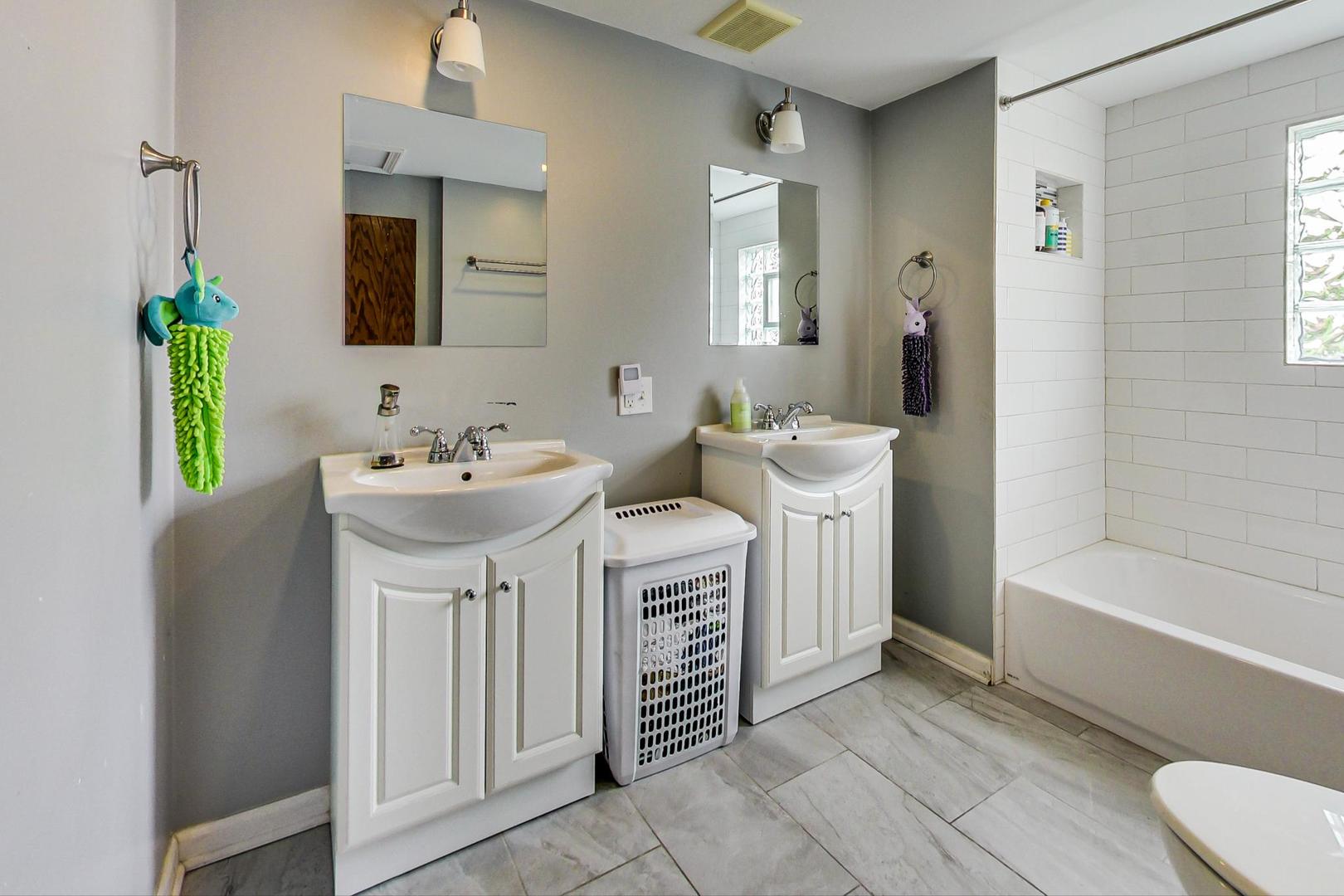 132 East Burlington Street Riverside, IL 60546 - Photo 29 of 38 a bathroom with a sink and a mirror