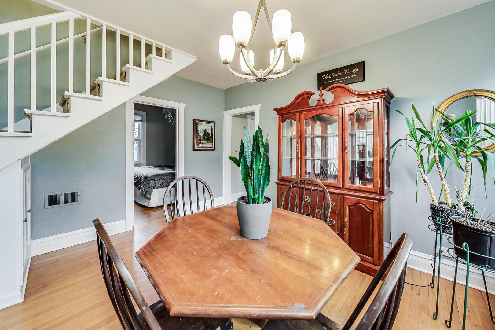 132 East Burlington Street Riverside, IL 60546 - Photo 9 of 38 a dining room with furniture entryway and wooden floor