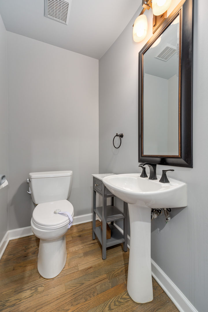 1718 West Huron Street Chicago, IL 60622 - Photo 13 of 33 a bathroom with a toilet and a sink