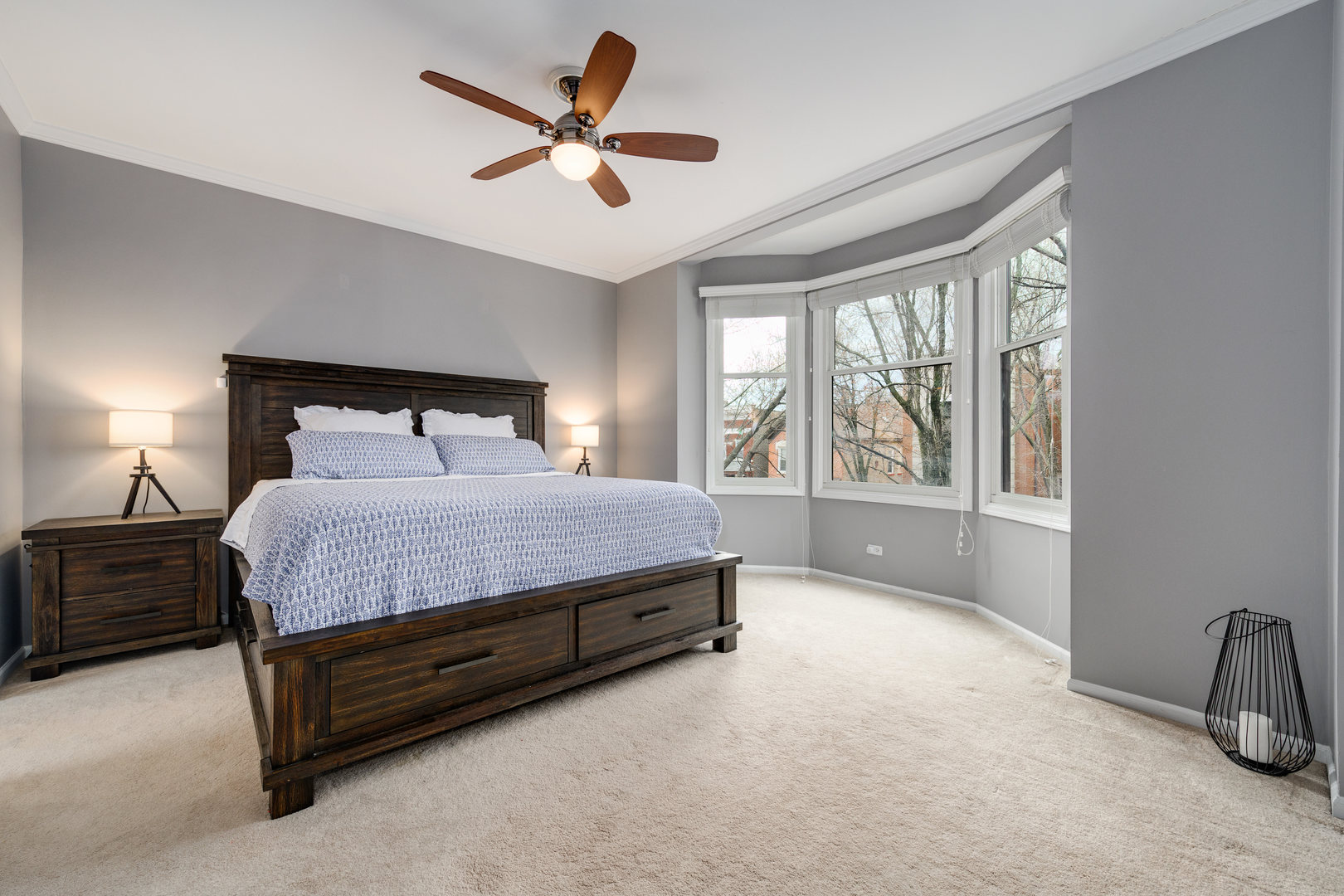 1718 West Huron Street Chicago, IL 60622 - Photo 15 of 33 a spacious bedroom with a bed a window and a chandelier