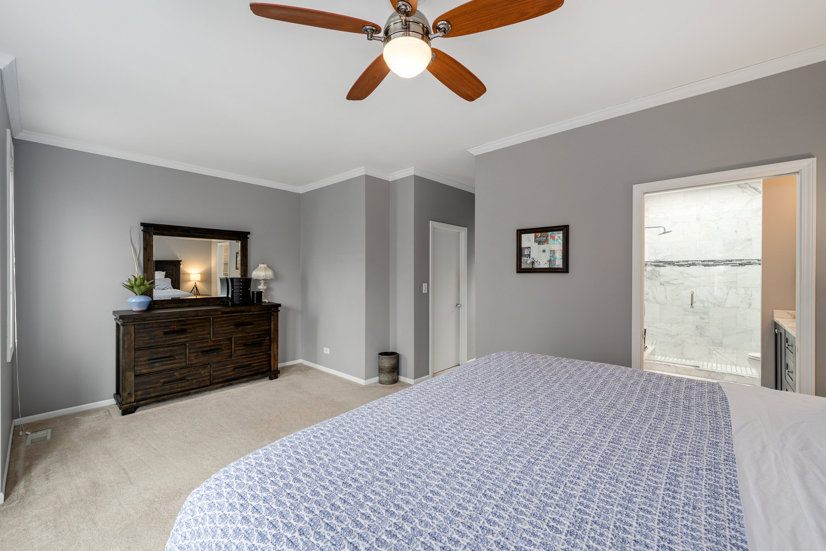 1718 West Huron Street Chicago, IL 60622 - Photo 16 of 33 a bedroom with a bed and a flat screen tv