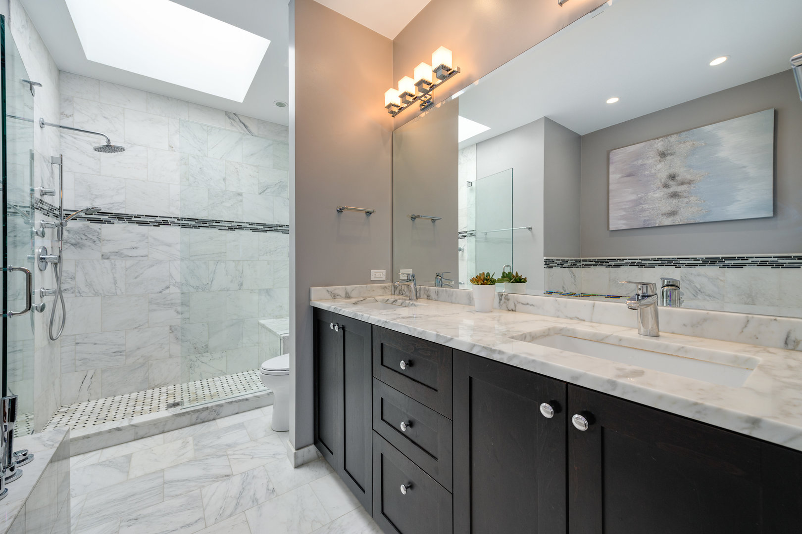 1718 West Huron Street Chicago, IL 60622 - Photo 17 of 33 a bathroom with a granite countertop sink a mirror a vanity and shower