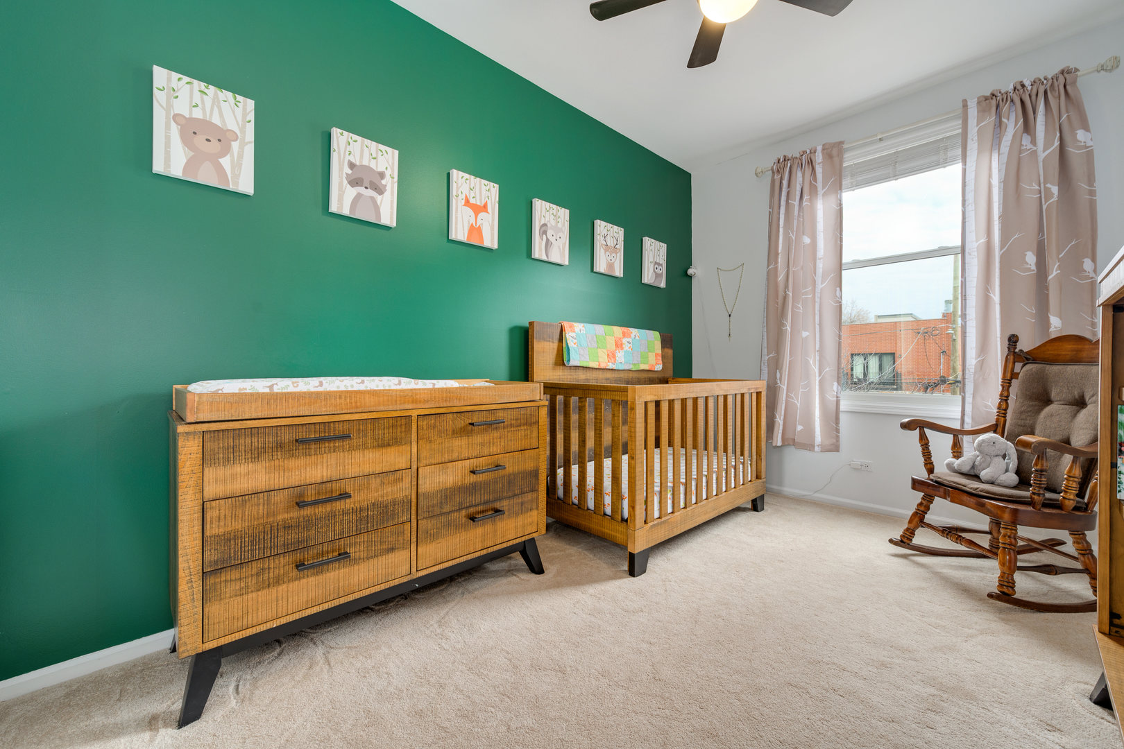 1718 West Huron Street Chicago, IL 60622 - Photo 19 of 33 a bedroom with a bed and a chandelier