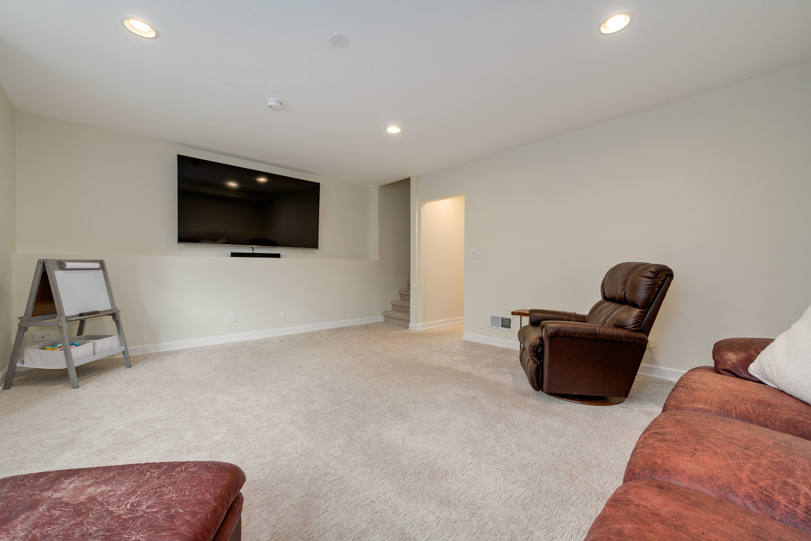 1718 West Huron Street Chicago, IL 60622 - Photo 23 of 33 a living room with furniture and a flat screen tv