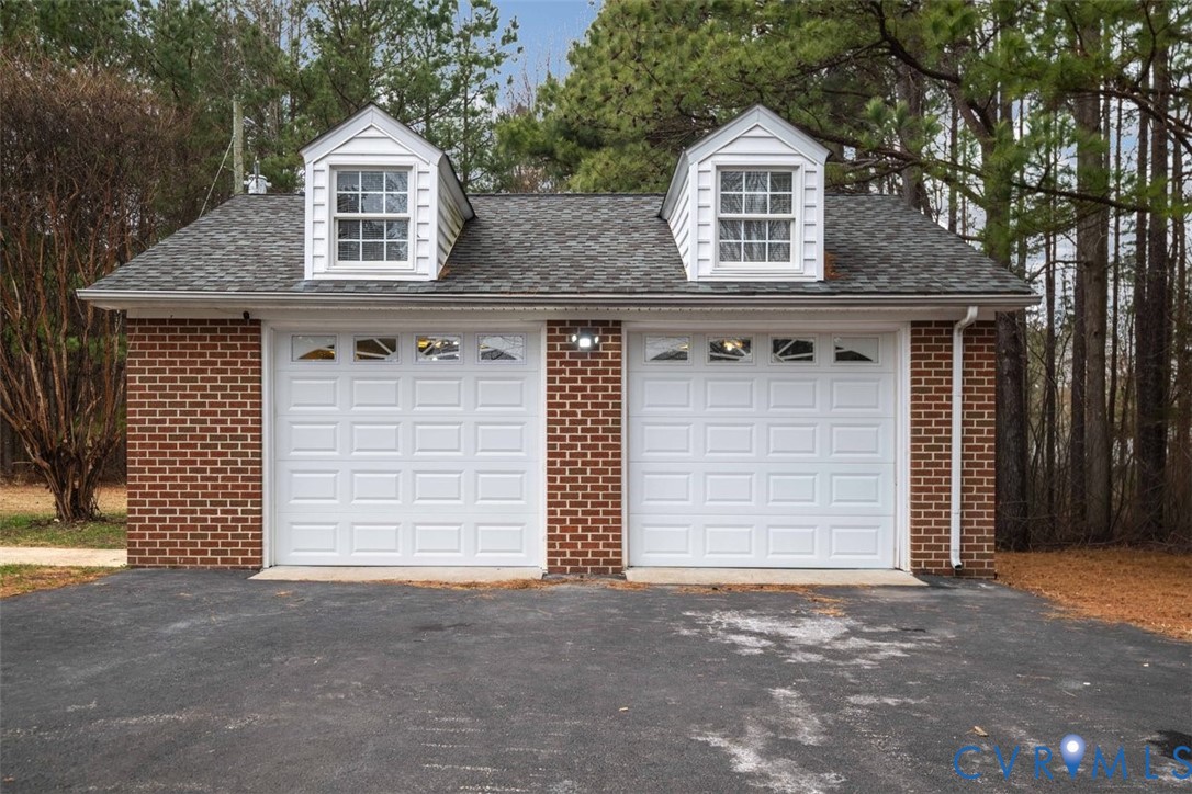 4040 Richmond Road Amelia Court House, VA 23002 - Photo 39 of 50 a front view of a house with a garage