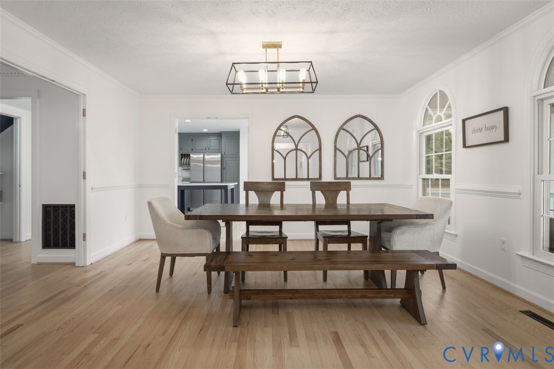 4040 Richmond Road Amelia Court House, VA 23002 - Photo 9 of 50 a view of a dining room with furniture and wooden floor