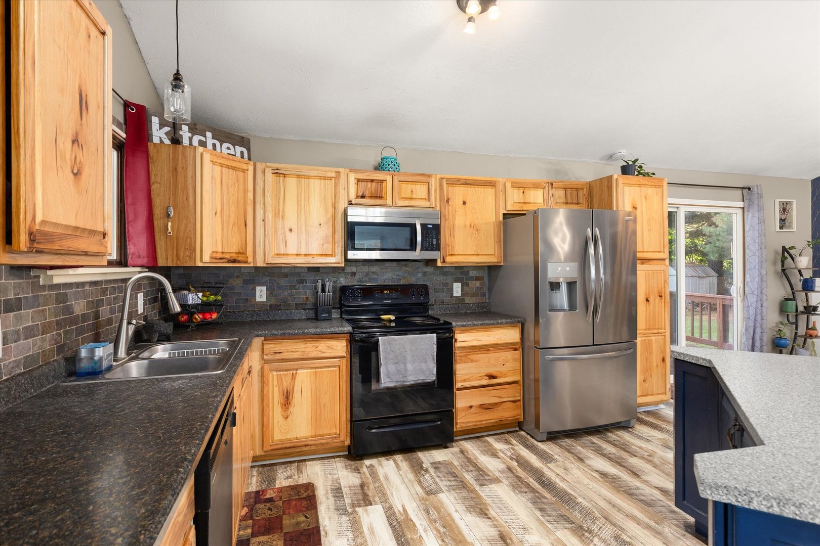 3440 Cardinal Lane Morris, IL 60450 - Photo 11 of 34 a kitchen with granite countertop a refrigerator and a sink